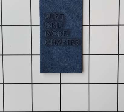 Buy Just One More Chapter Denim fabric wrapped bookmark.