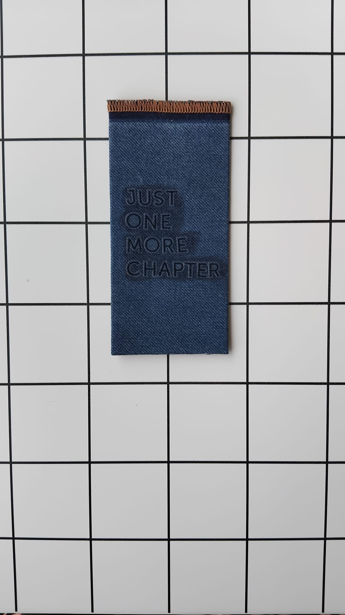 Buy Just One More Chapter Denim fabric wrapped bookmark.