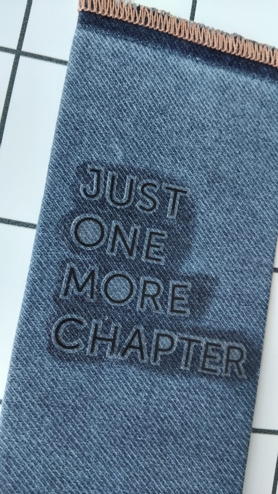 Buy Just One More Chapter Denim fabric wrapped bookmark.
