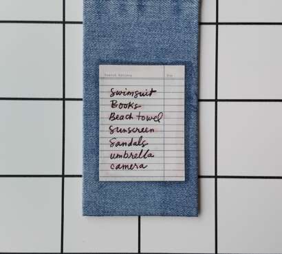 Purchase Holiday List Denim fabric wrapped bookmark.