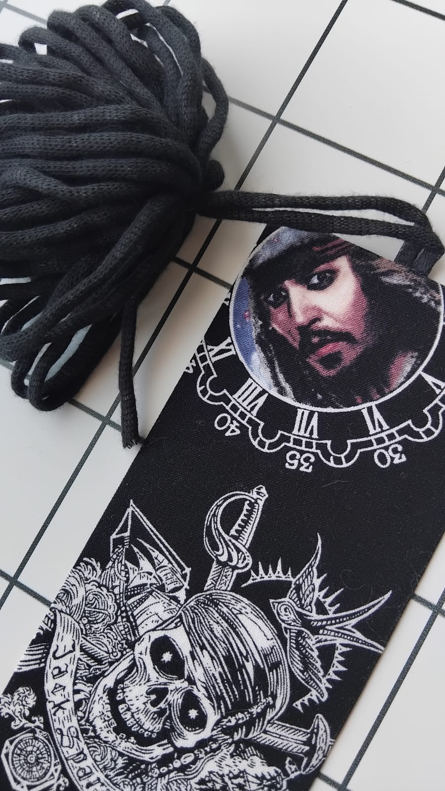 Buy Pirates of the Caribbean fabric wrapped bookmark.